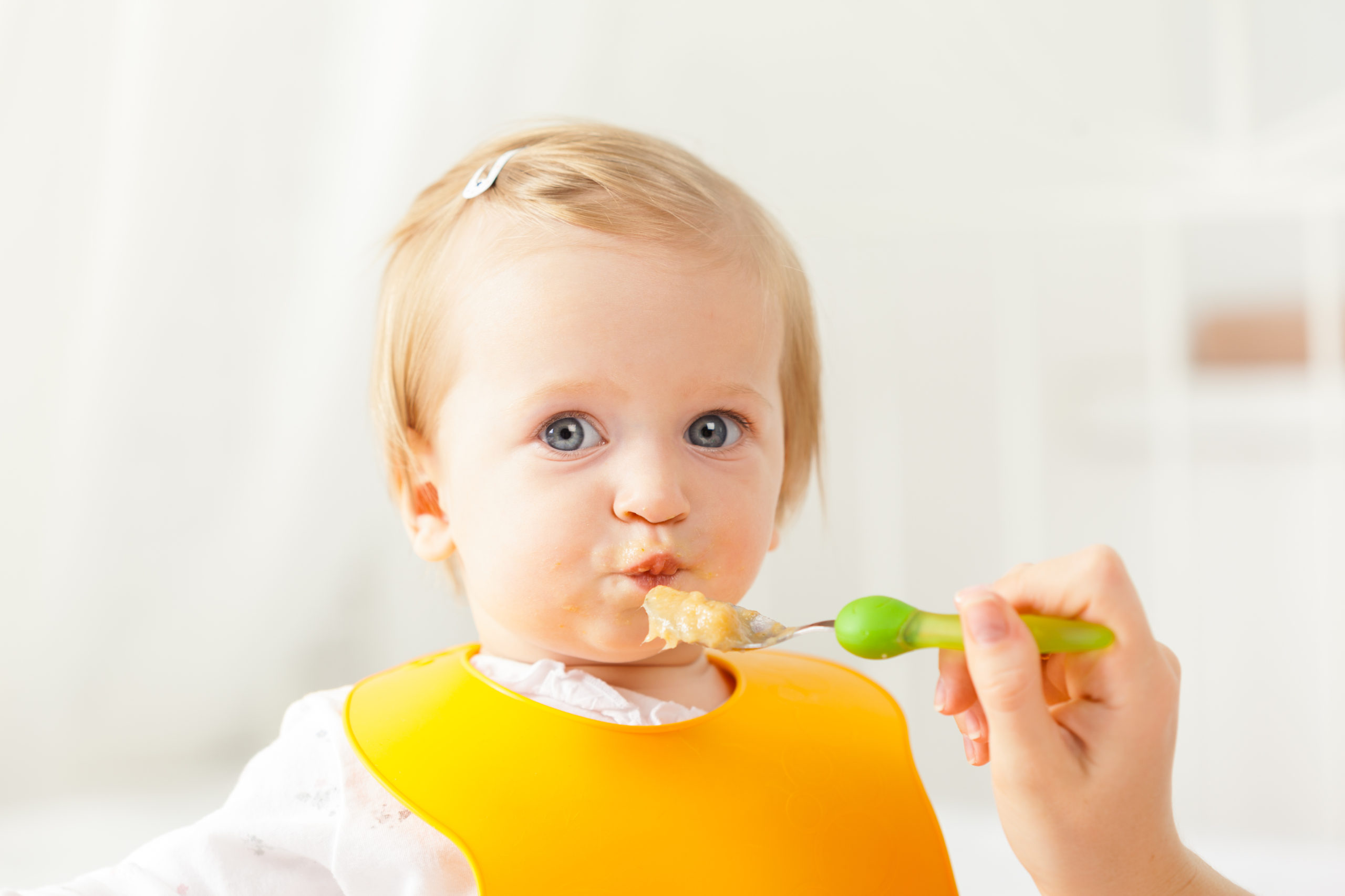 Little,Baby,Feeding,With,A,Spoon